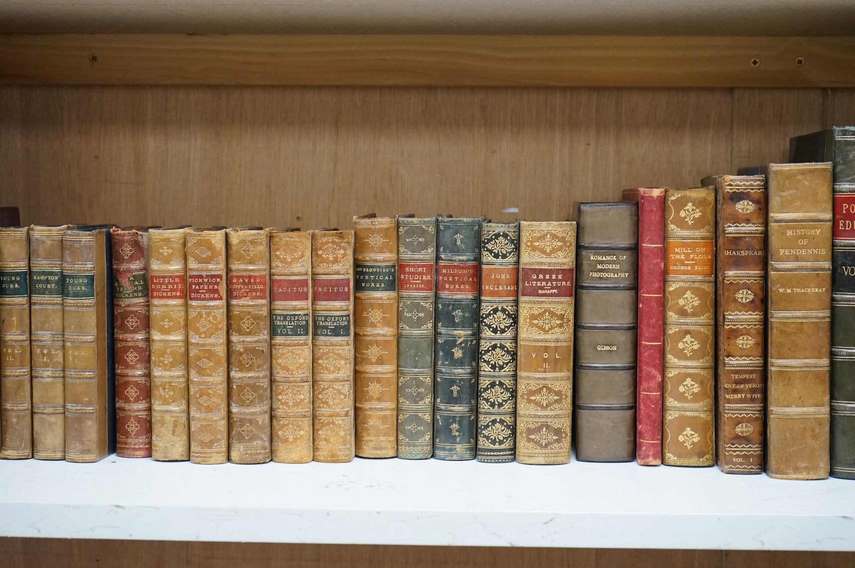 A collection of approximately seventy 19th century and later mixed leather bound books to include Charles Dickens and Rudyard Kipling. Condition - fair to good